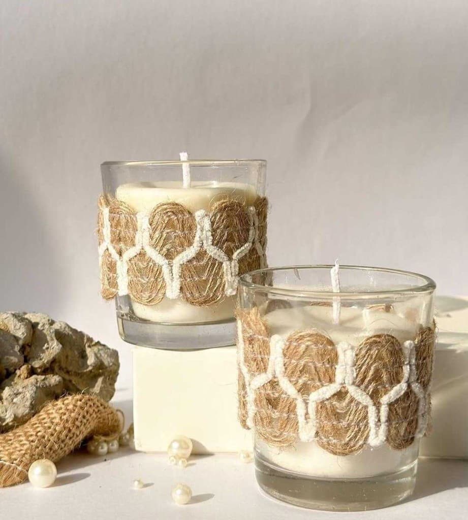 Two artisan candles with handwoven jute bands